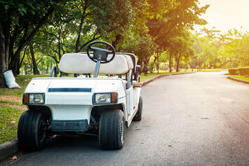 Picture of a golf cart on a Paved  path